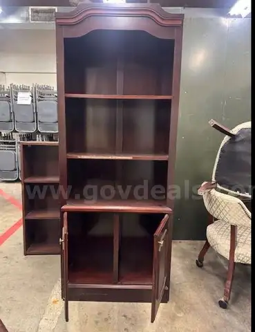 Executive Bookcase, Conference Table with Chairs and a Oversized Leather Chair