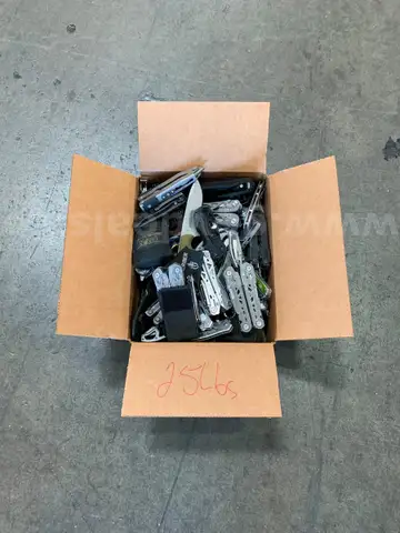 Box of Gerber Knives and Multi Tools