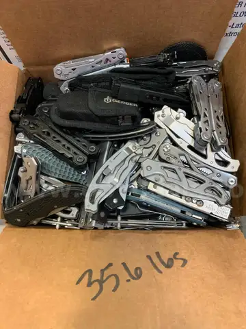 Box of Gerber Knives and Multi Tools