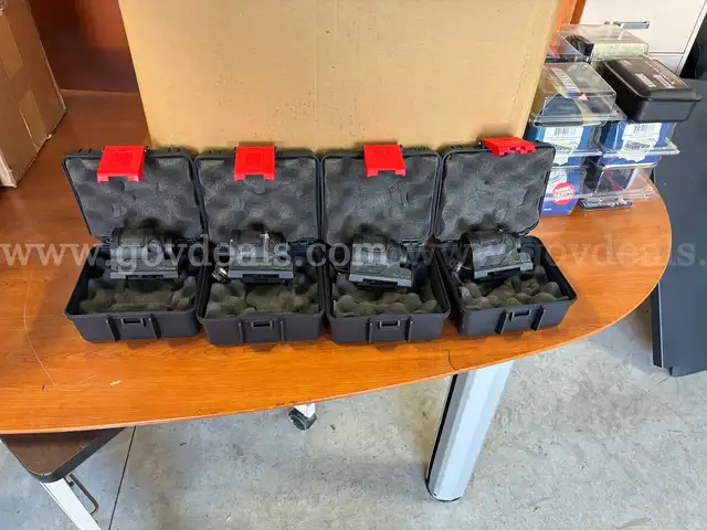 4x Trijicon Rifle Optics and empty optic boxes