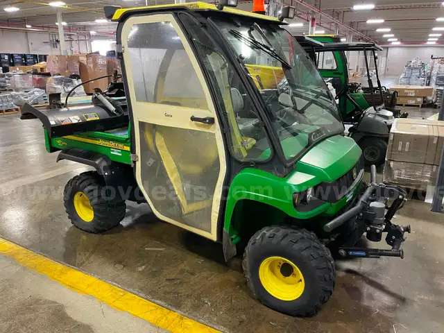 John Deere 4x4 Gator with Cab and Snow Blade