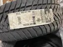 Pallet of (4) Goodyear P235/55/R17 Tires and Metal/Steel Vehicle Partitions