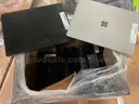 Lot of Surface Laptops and a Dell Desktop PC