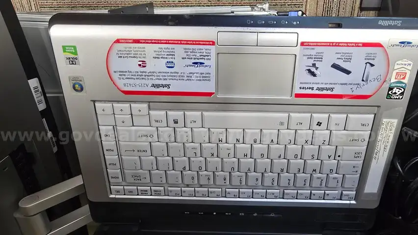 Lot of various computer equipment, tablets, monitors, and electronics.