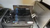 Lot of various computer equipment, tablets, monitors, and electronics.