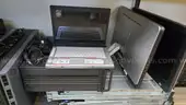 Lot of various computer equipment, tablets, monitors, and electronics.