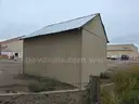 Approximate 15&#x27; 10&#x22; x 11&#x27; 9&#x22; building with garage door