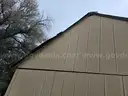 Approximate 15&#x27; 10&#x22; x 11&#x27; 9&#x22; building with garage door