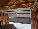 Approximate 15&#x27; 10&#x22; x 11&#x27; 9&#x22; building with garage door