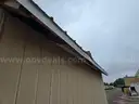 Approximate 15&#x27; 10&#x22; x 11&#x27; 9&#x22; building with garage door