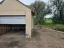Approximate 15&#x27; 10&#x22; x 11&#x27; 9&#x22; building with garage door