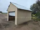Approximate 15&#x27; 10&#x22; x 11&#x27; 9&#x22; building with garage door