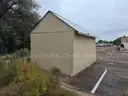 Approximate 15&#x27; 10&#x22; x 11&#x27; 9&#x22; building with garage door