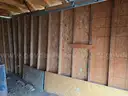 Approximate 15&#x27; 10&#x22; x 11&#x27; 9&#x22; building with garage door