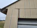 Approximate 15&#x27; 10&#x22; x 11&#x27; 9&#x22; building with garage door