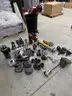 Assortment of Nozzles, Fittings, Caps, and Firefighting Equipment