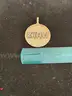 14K gold medallion with diamonds. Weight: 77.6 grams