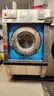 Lot of Commercial Laundry Equipment: Three (3) Washers, Three (3) Dryers with Chemical Pumps