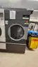 Lot of Commercial Laundry Equipment: Three (3) Washers, Three (3) Dryers with Chemical Pumps