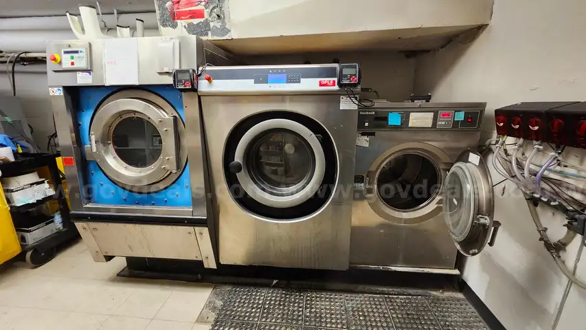 Lot of Commercial Laundry Equipment: Three (3) Washers, Three (3) Dryers with Chemical Pumps