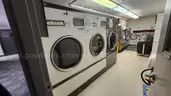 Lot of Commercial Laundry Equipment: Three (3) Washers, Three (3) Dryers with Chemical Pumps