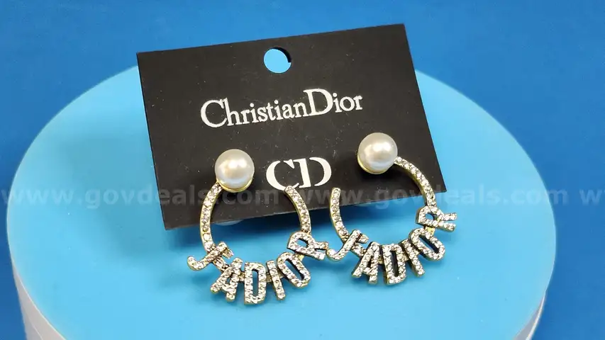 Earrings: Christian Dior (1 pair)