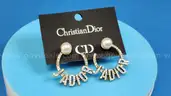 Earrings: Christian Dior (1 pair)
