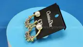 Earrings: Christian Dior (1 pair)