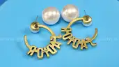 Earrings: Christian Dior (1 pair)