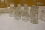 (1) Set of 31 Glass Flasks, Dishes, and Ceramic Funnel