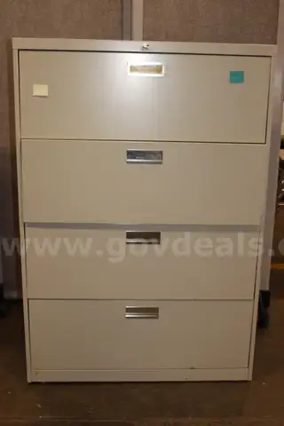 (1) Four-Drawer Metal File Cabinet