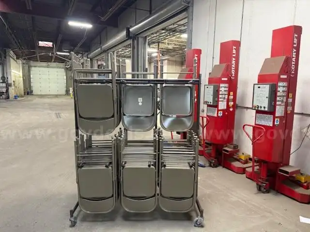 Lot of 57 Steel Folding Chairs w/Rolling Rack