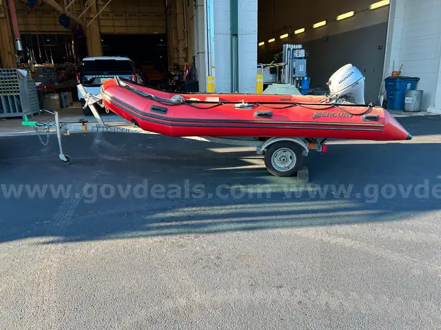 Mercury Inflatable Boat w/9.9hp Honda and EZ Loader Trailer
