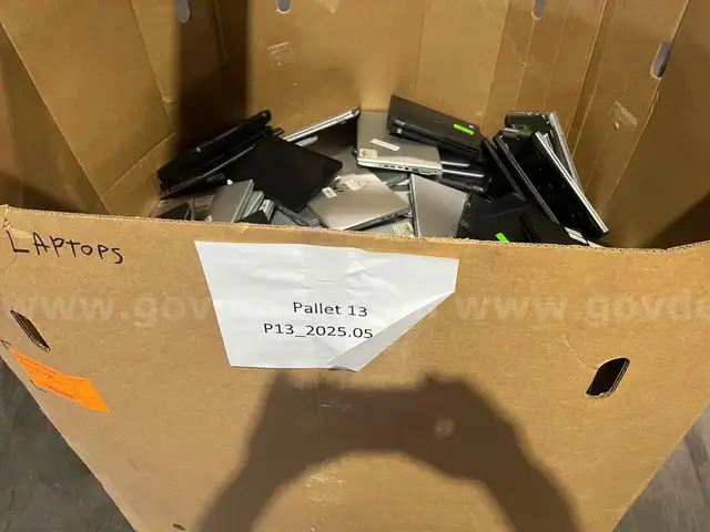 BIN OF LAPTOPS
