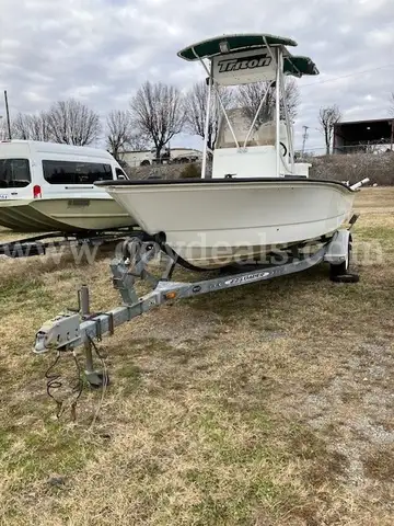 TRITON ENFORCER C/C BOAT WITH MOTOR AND TRAILER
