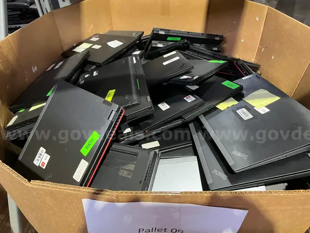 BIN OF LAPTOPS