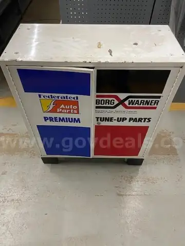 Metal Cabinet with Logos of Federated Auto Parts and Warner
