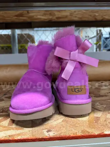 2 pairs of pink Ugg boots