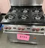 **** WOLF-STAINLESS STEEL 6-BURNER RANGE WITH CONVECTION OVEN AND BACK SPLASH **** (I)