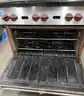 **** WOLF-STAINLESS STEEL 6-BURNER RANGE WITH CONVECTION OVEN AND BACK SPLASH **** (I)