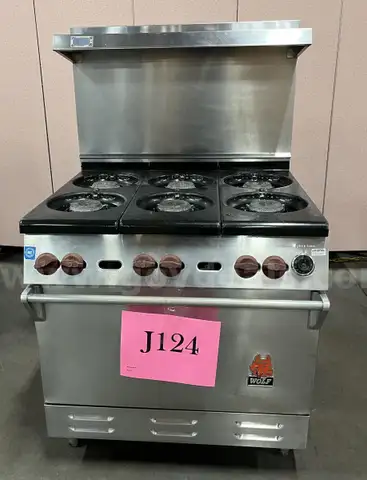 **** WOLF-STAINLESS STEEL 6-BURNER RANGE WITH CONVECTION OVEN AND BACK SPLASH **** (I)
