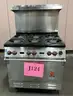 **** WOLF-STAINLESS STEEL 6-BURNER RANGE WITH CONVECTION OVEN AND BACK SPLASH **** (I)
