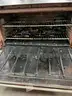 **** WOLF-STAINLESS STEEL 6-BURNER RANGE WITH CONVECTION OVEN AND BACK SPLASH **** (I)