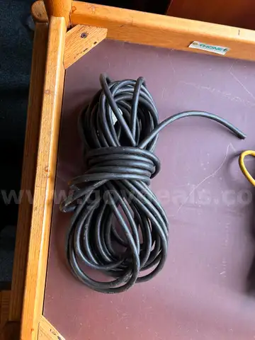 Extension Cord, about 25 feet. Did not unwrap for more precise measurment.