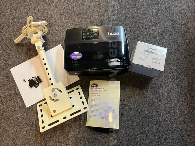 Projector for teaching in a small to medium-sized room, includes spare bulb.