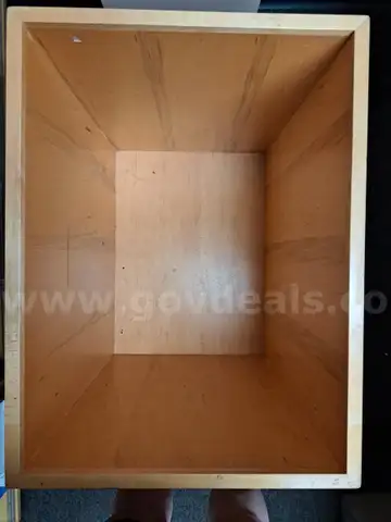 Two blonde wood boxes on casters