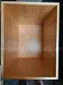 Two blonde wood boxes on casters
