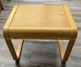 Blonde wood end table, loop legs