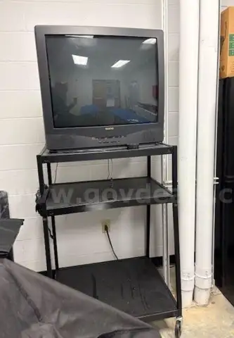Lot #552; TV with Cart (TV works)