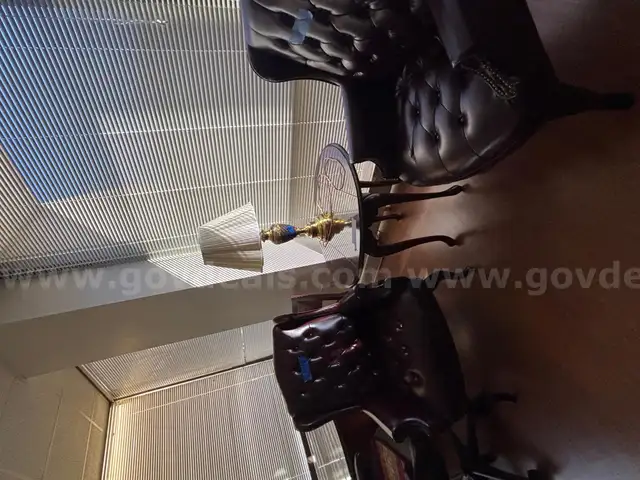 2 Leather High back Chairs and Wood Table with Lamp